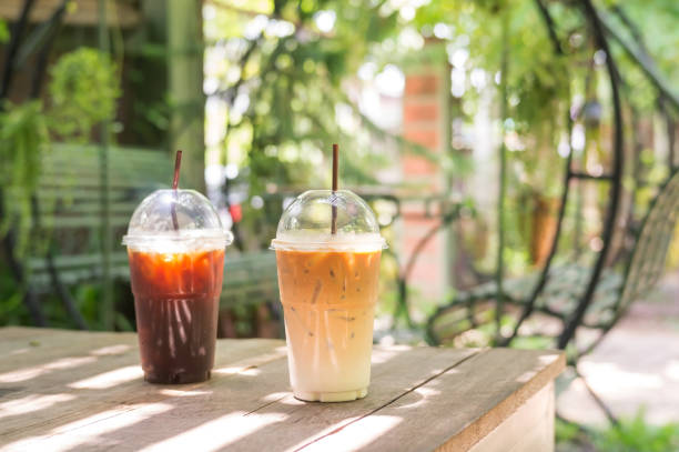 istock iced latte and americano coffee on a wooden table. 811864438