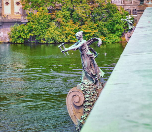 Prague, Czech Republic. Statue of a woman with torches on the Cechuv Bridge in Prague