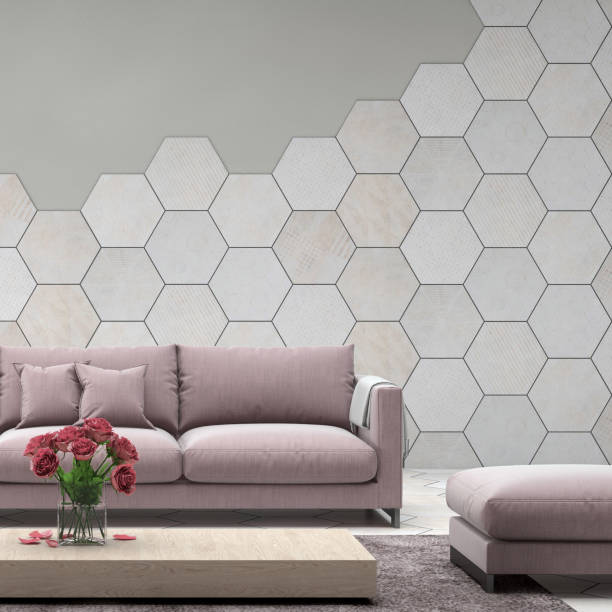 Interior with pastel baby pink colored sofa with blank wall