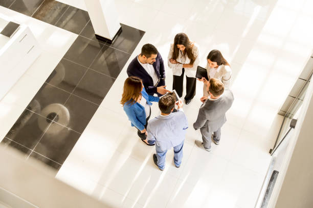 istock Young business people in the modern office, viewed from above 811870350
