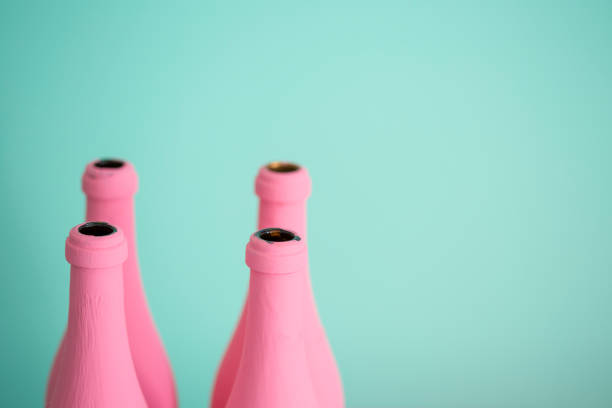 istock Pink bottles against pastel turquoise background 811880368