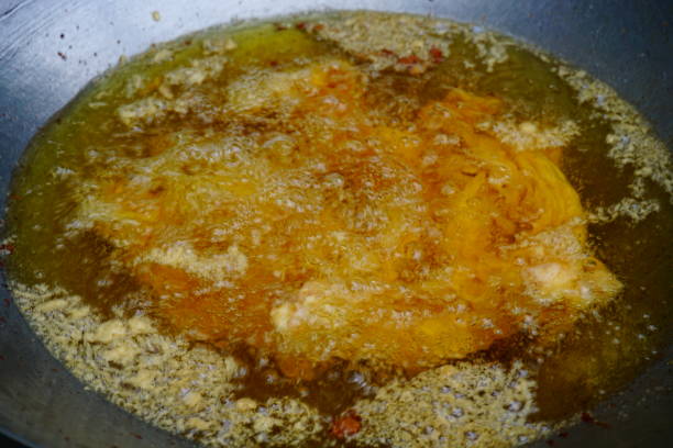 istock Frying pork and Oil in pan 811887940
