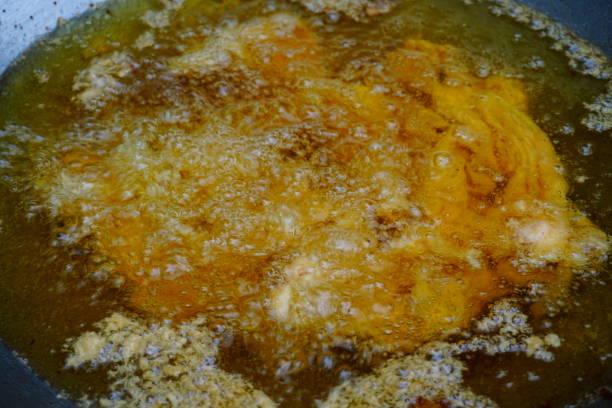 istock Frying pork and Oil in pan 811887952