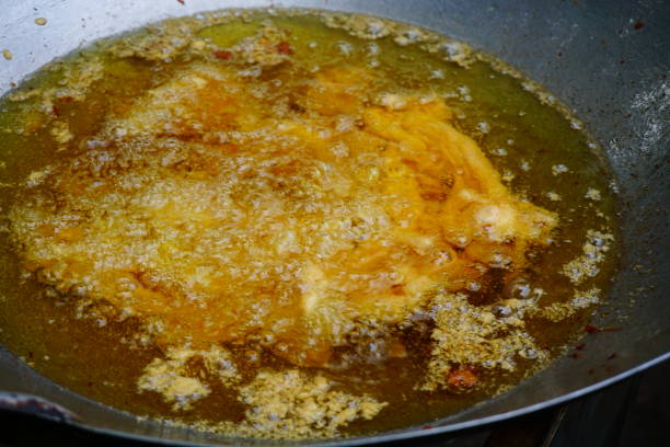 istock Frying pork and Oil in pan 811887958