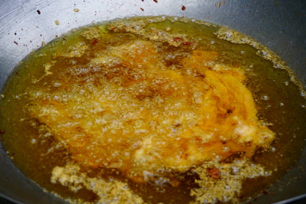 istock Frying pork and Oil in pan 811887960