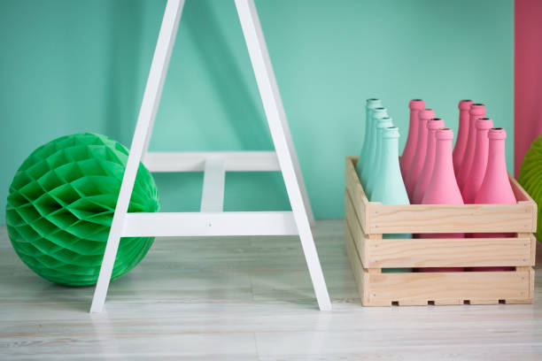 istock Green pom pom and pastel colored bottles 811888382