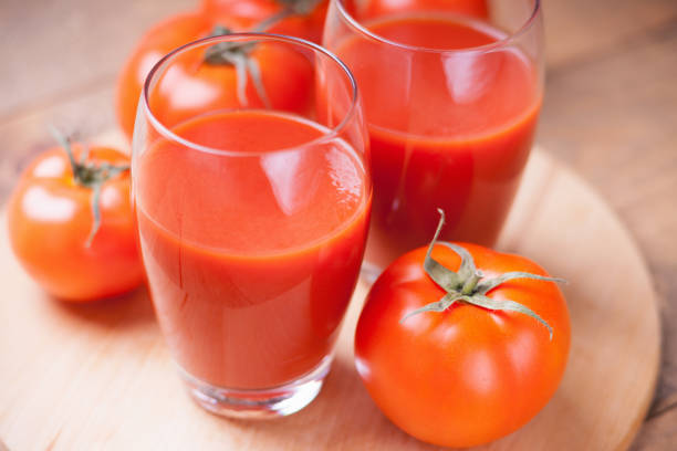 istock Tomatoes and glasses of fresh tomato juice 811888726