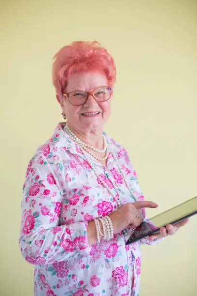 Photo of Senior woman using digital tablet