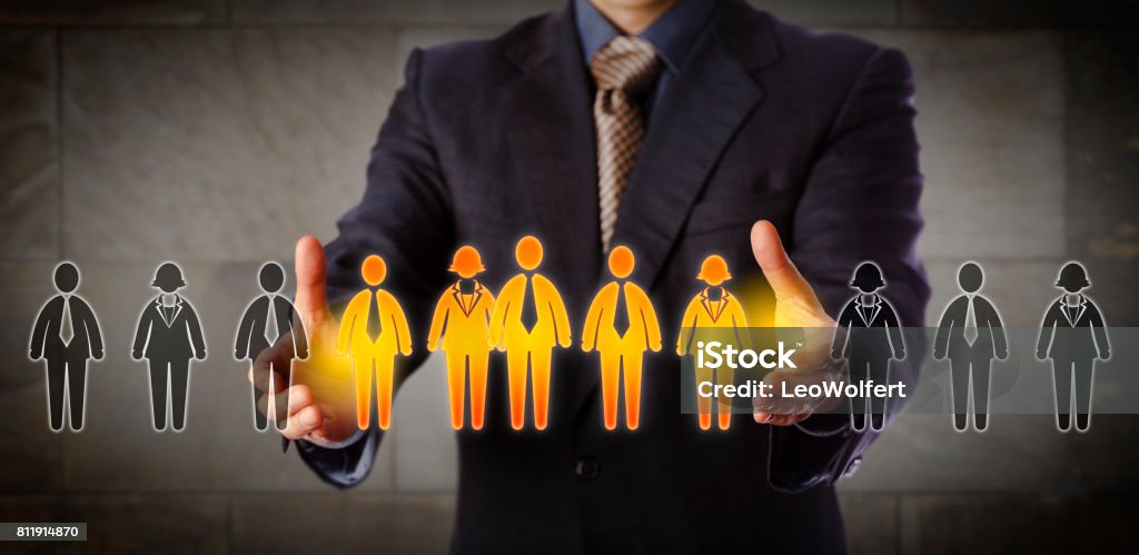 Director Building A Mixed Gender Management Team Blue chip recruitment manager selecting a group of five employees in a lineup of worker icons. Business concept for team building, customer segmentation and management succession. Wide composition. Skill Stock Photo