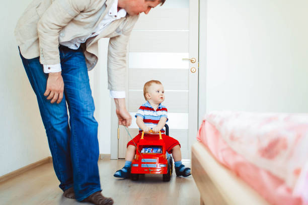 istock Little boy is riding a car 811921660