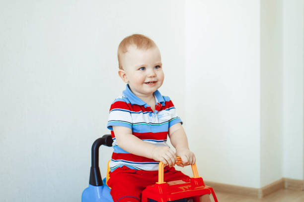 istock Little boy is riding a car 811921816