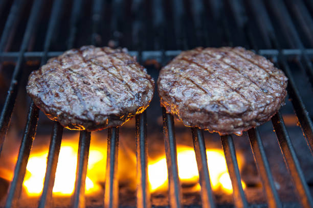 istock juicy meat patties on bbq 811952936
