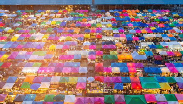 istock Aerial view multiple colour flea market rooftop 811955762