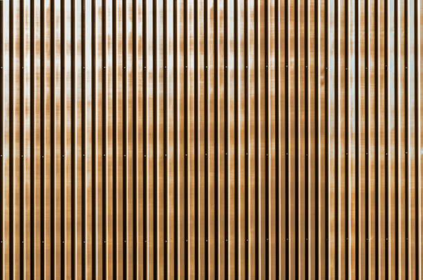 istock Old rusty corrugated metal wall of a barn building 811964442