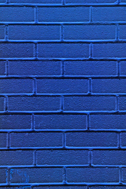 istock midnight blue brick wall moody lighting abstract 811970398