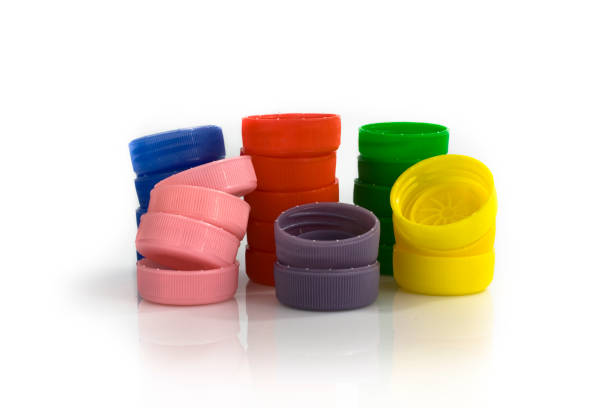 istock Stacks of plastic bottle caps on white background 811981394