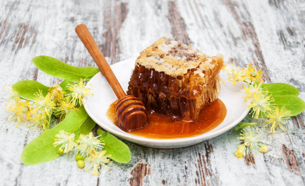 istock Honeycomb and linden flowers 811987758
