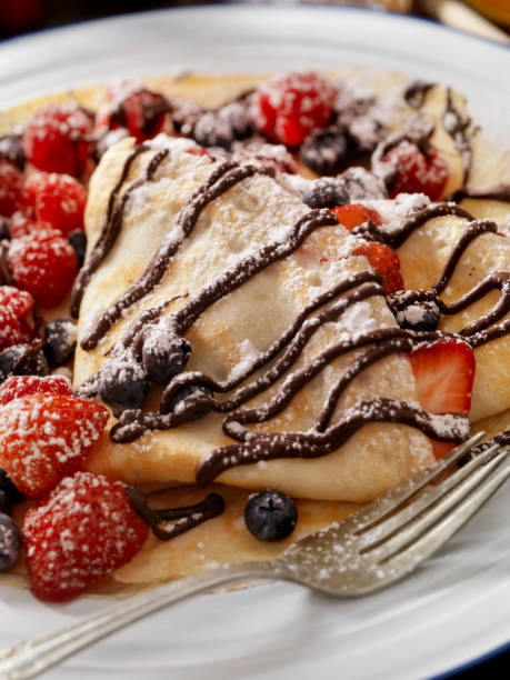 istock Crepes with Chocolate Sauce and Powdered Sugar 811988338