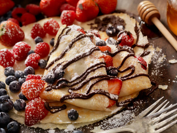 istock Crepes with Chocolate Sauce and Powdered Sugar 811988342