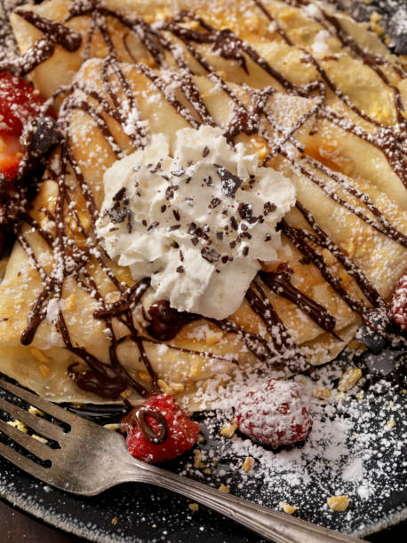 istock Crepes with Chocolate Sauce and Whip Cream 811994568