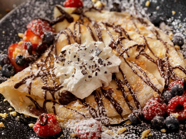 istock Crepes with Chocolate Sauce and Whip Cream 811994694