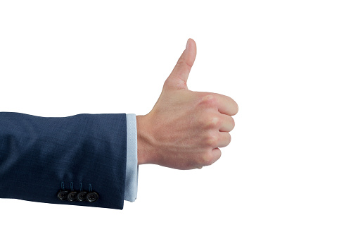 Close up male hand showing thumbs up sign isolated on white background with clipping path.