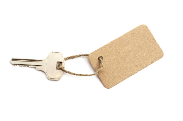 istock Carton tag with key isolated on white background 811995150