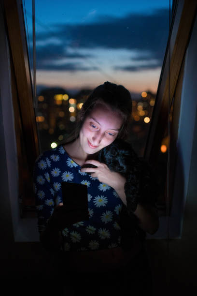 istock Young woman taking selfie with her dog 812009752