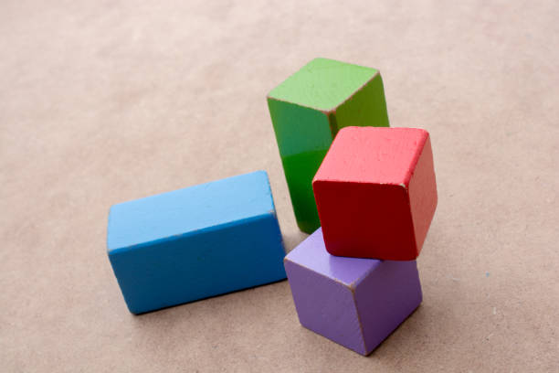 istock Colorful building  blocks on brown background 812009758