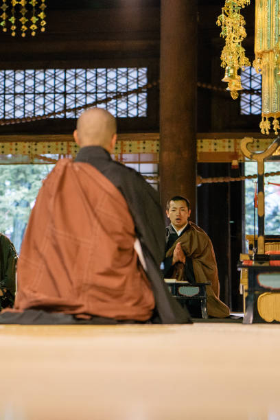 istock Monks praying during morning cerimony inside a buddhist temple 812022664