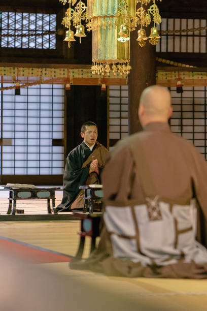 istock Monks praying during morning cerimony inside a buddhist temple 812023376