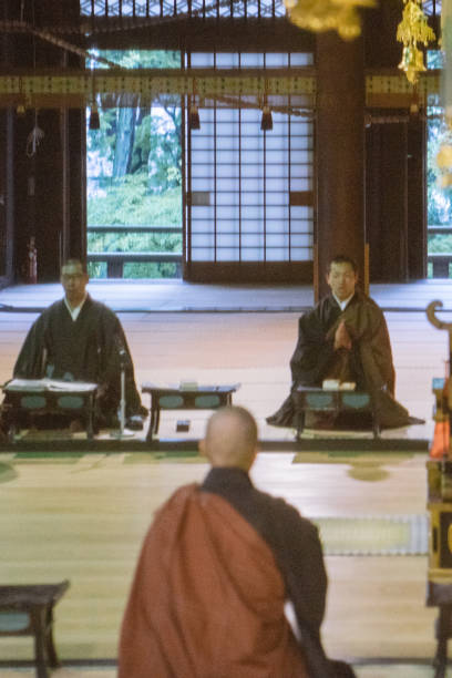 istock Monks praying during morning cerimony inside a buddhist temple 812031678