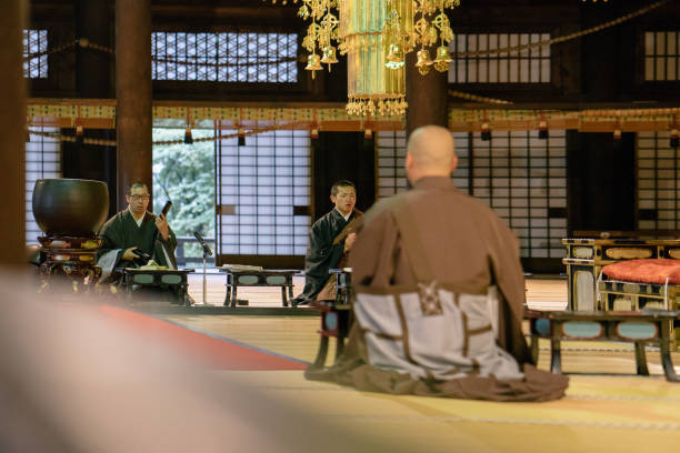 istock Monks praying during morning cerimony inside a buddhist temple 812031926