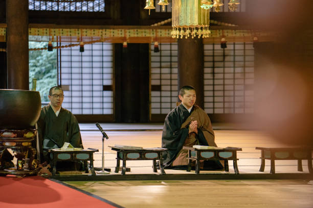 istock Monks praying during morning cerimony inside a buddhist temple 812034472