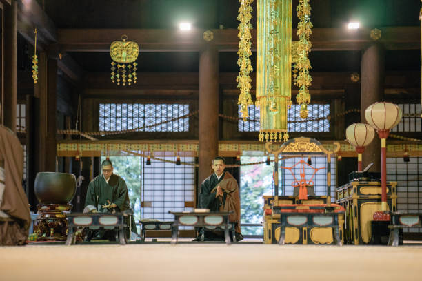istock Monks praying during morning cerimony inside a buddhist temple 812035102