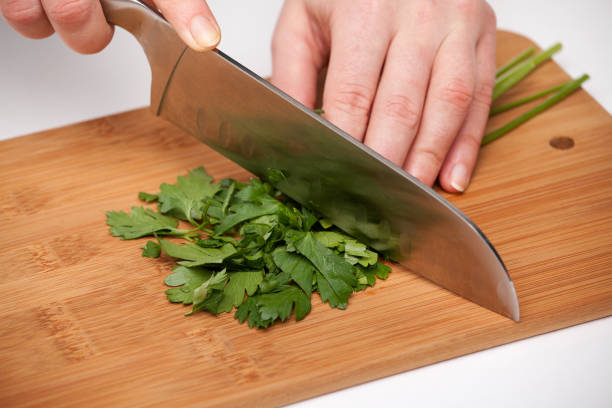 istock Cutting the vegetables with a kitchen knife on the board 812047174