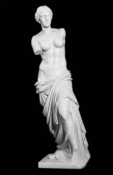 Photo of gypsum statue of a woman in a classic style