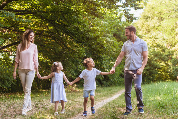 istock Happy family taking a walk in nature 812052194