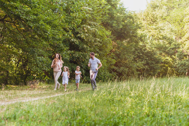 istock Family running carelessly in nature 812052460
