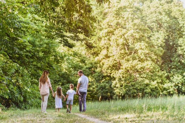 istock Family in nature in distance 812052702