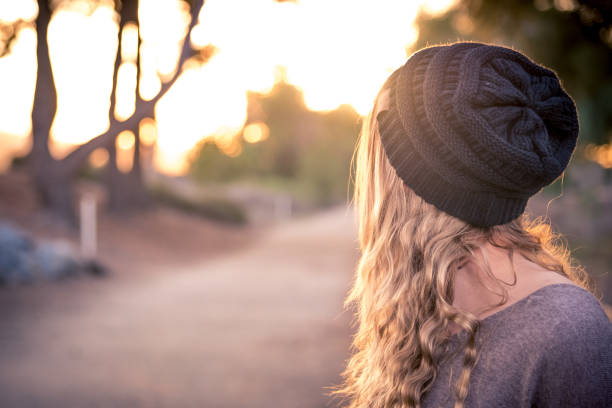 istock A female model with a beanie during golden hour. 812054876