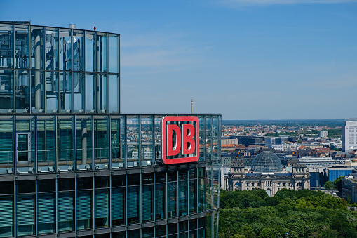 Berlin, Germany - june 9, 2017: The logo of the Deutsche Bahn AG ( German Railroad Company) on top of the Headquarter office building in Berlin, Germany.