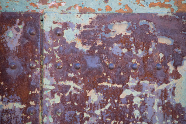 istock Close up of damaged rusty painted textured metal 812075924