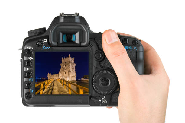 istock Hand with camera and Belem Tower - Lisbon Portugal (my photo) 812083288