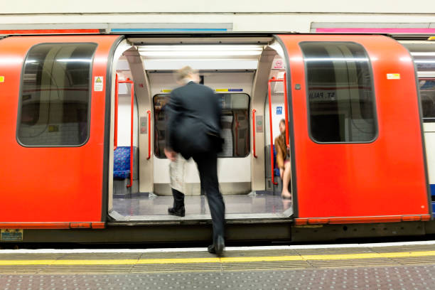 A person boarding an underground carriage in London