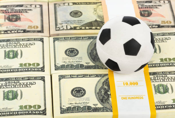 istock Money and soccer ball 812097064