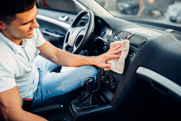 istock Male hands cleans auto, car dashboard polishing 812104090