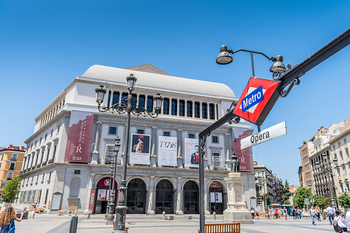 Madrid, Spain - June 23, 2017: Plaza de Isabel II, in the heart of Madrid has a Metro Opera subway station and Royal Theater.