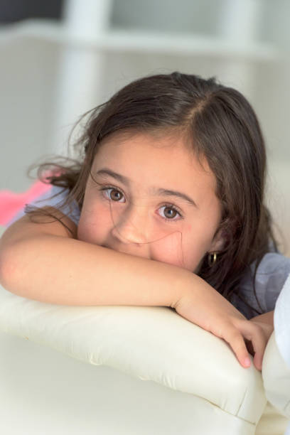 istock little girl looking at the camera 812141178