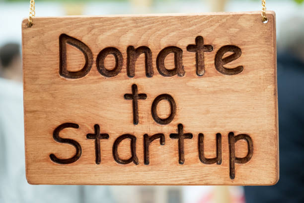 istock Wooden plate with Donate to Startup text 812148994
